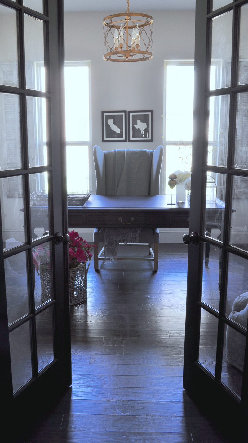 Elegant Home Office with Black Desk and Black French Doors