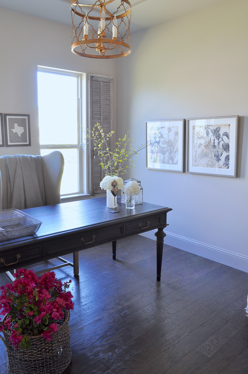 Home Office with Black Desk and Vintage Gray Interior Shutters