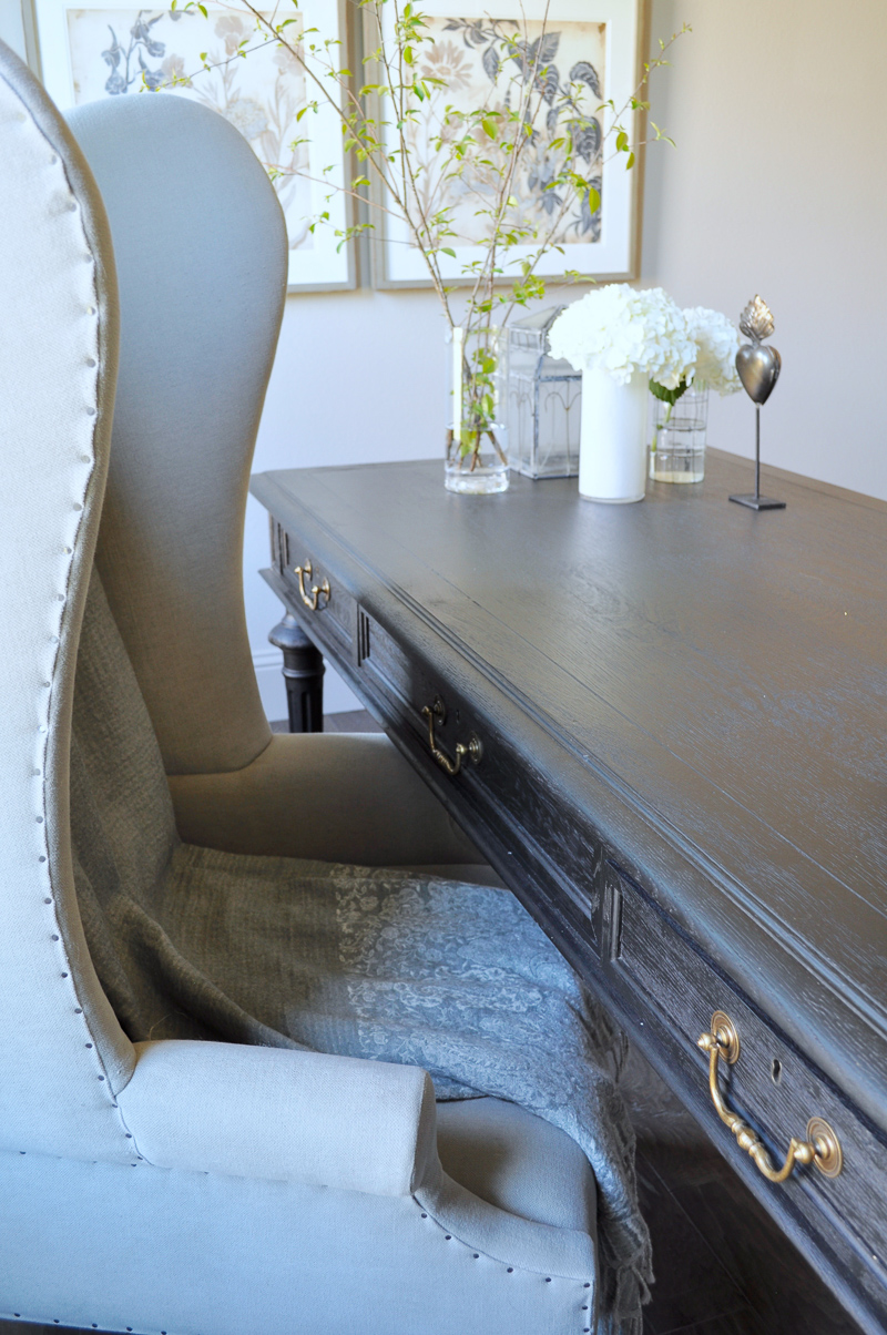 Home Office with Black Desk with Gold Pulls and Gray Wingback Ch