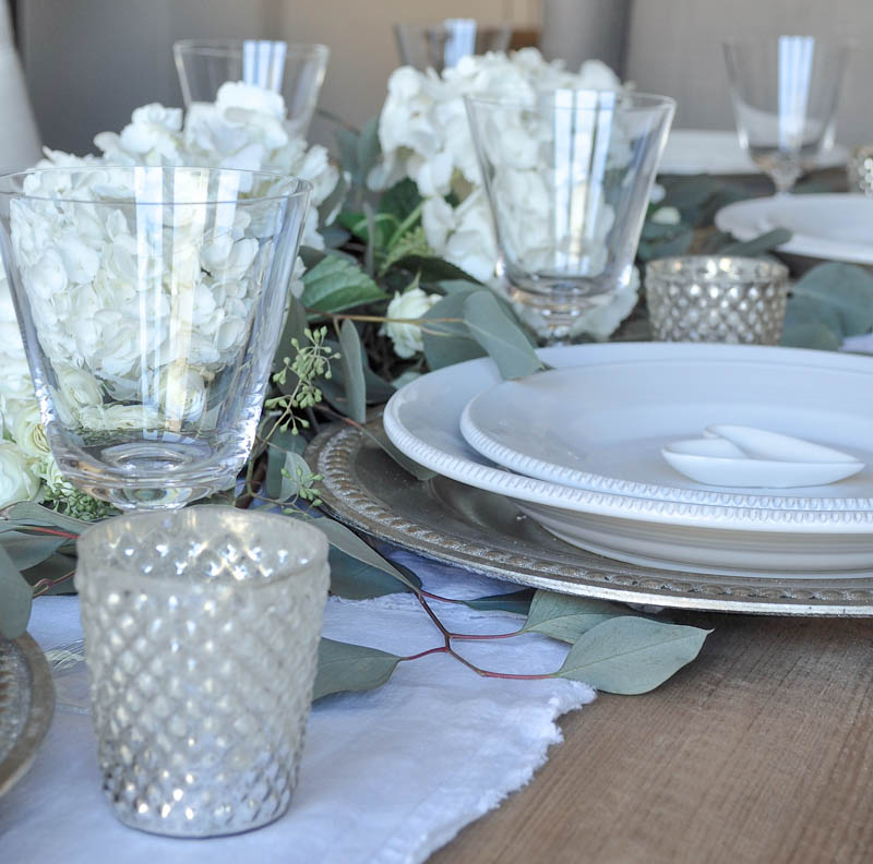 White Table Setting with Silver Chargers and Votive