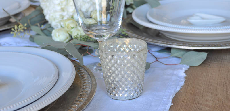 White Table Setting with Silver Chargers and Votive