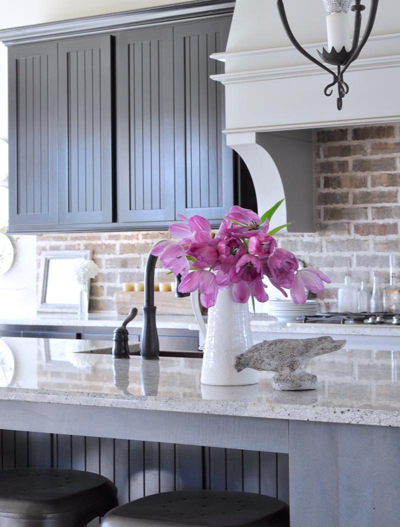 Pink Flowers in a White Pitcher Spring Decor Kitchen with Brick