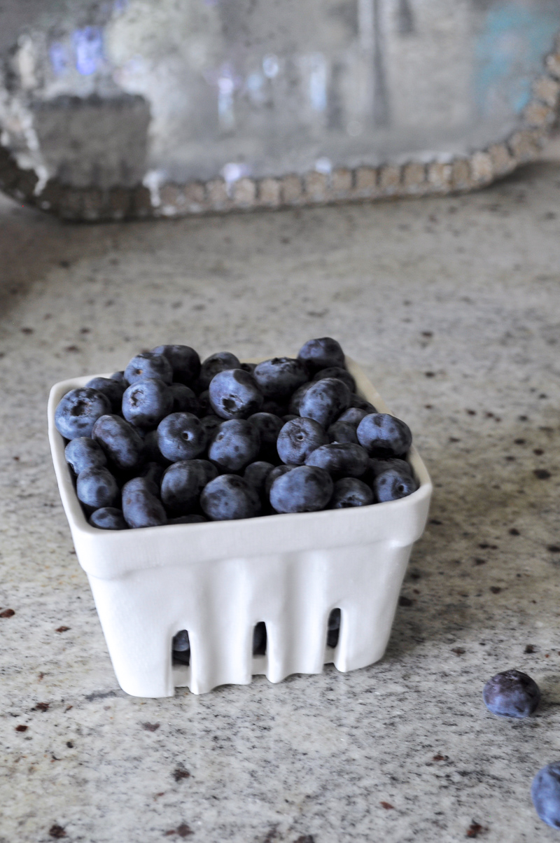 White Ceramic Berry Basket on Light Gray Kitchen Counter