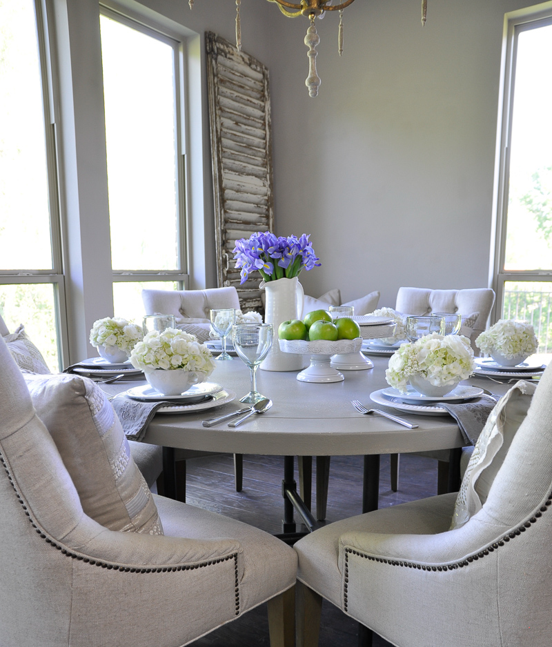 beautiful white tablescape with green apple on cake stands