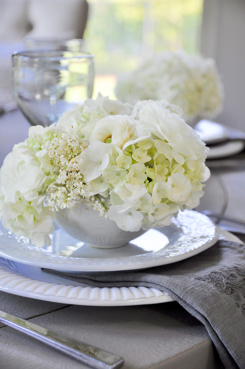 teacups filled with white flowers for shower luncheon wedding