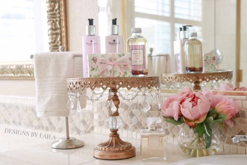 Beautiful Cake Stand in a Bathroom with Necessities by Designs by Laila