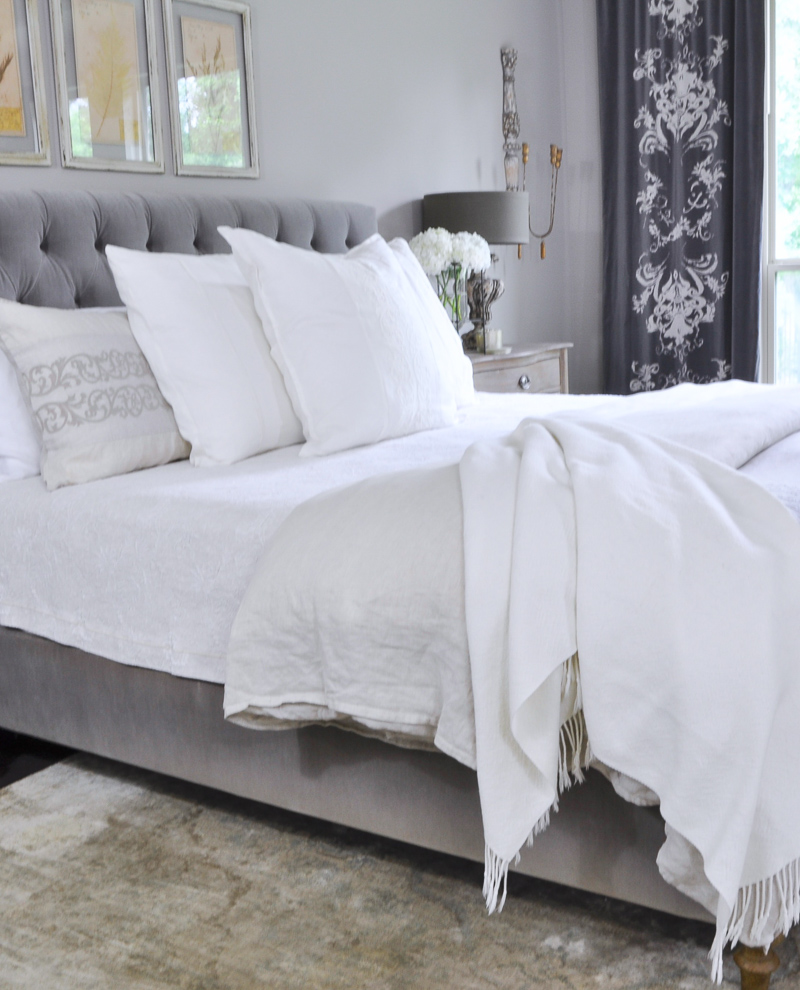 Beautiful Gray Bedroom with Linen Bedding and Gray Tufted Bed