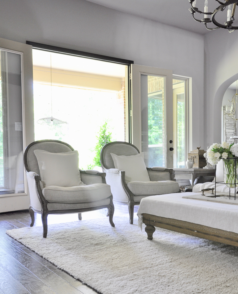 Family Room with Beautiful Linen Arm Chairs by Decor Gold Designs