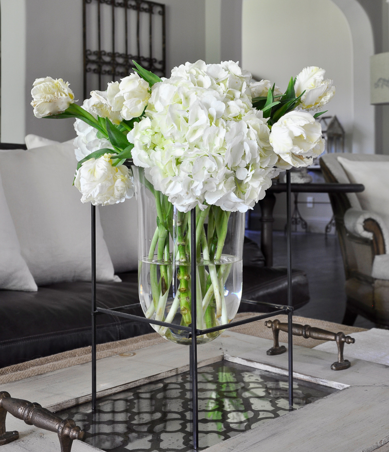 Family Room with Tray and Suspended Vase by Decor Gold Designs_