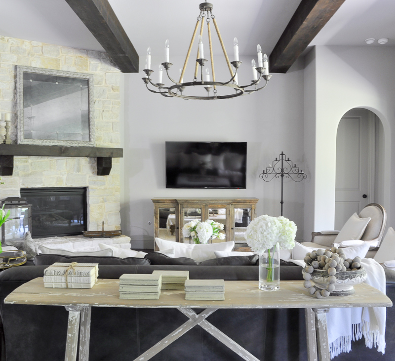 Stunning Family Room with Beams and Rustic Charm by Decor Gold Designs_