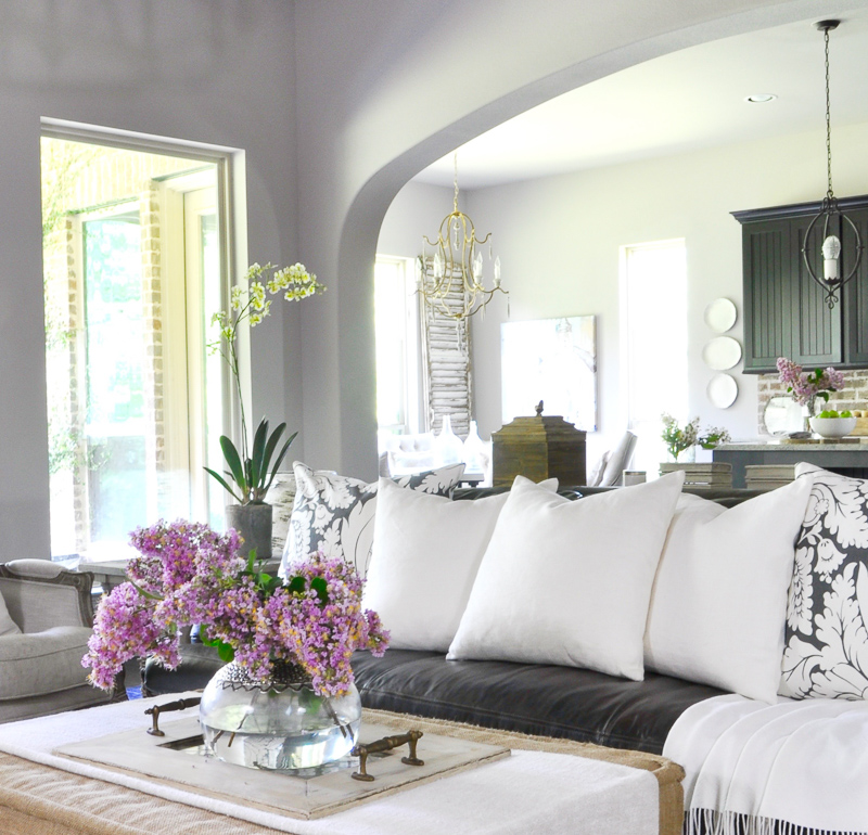 Beautiful White Accents in Family Room Ottoman with Vase Full of Summer Crepe Myrtle Clippings_