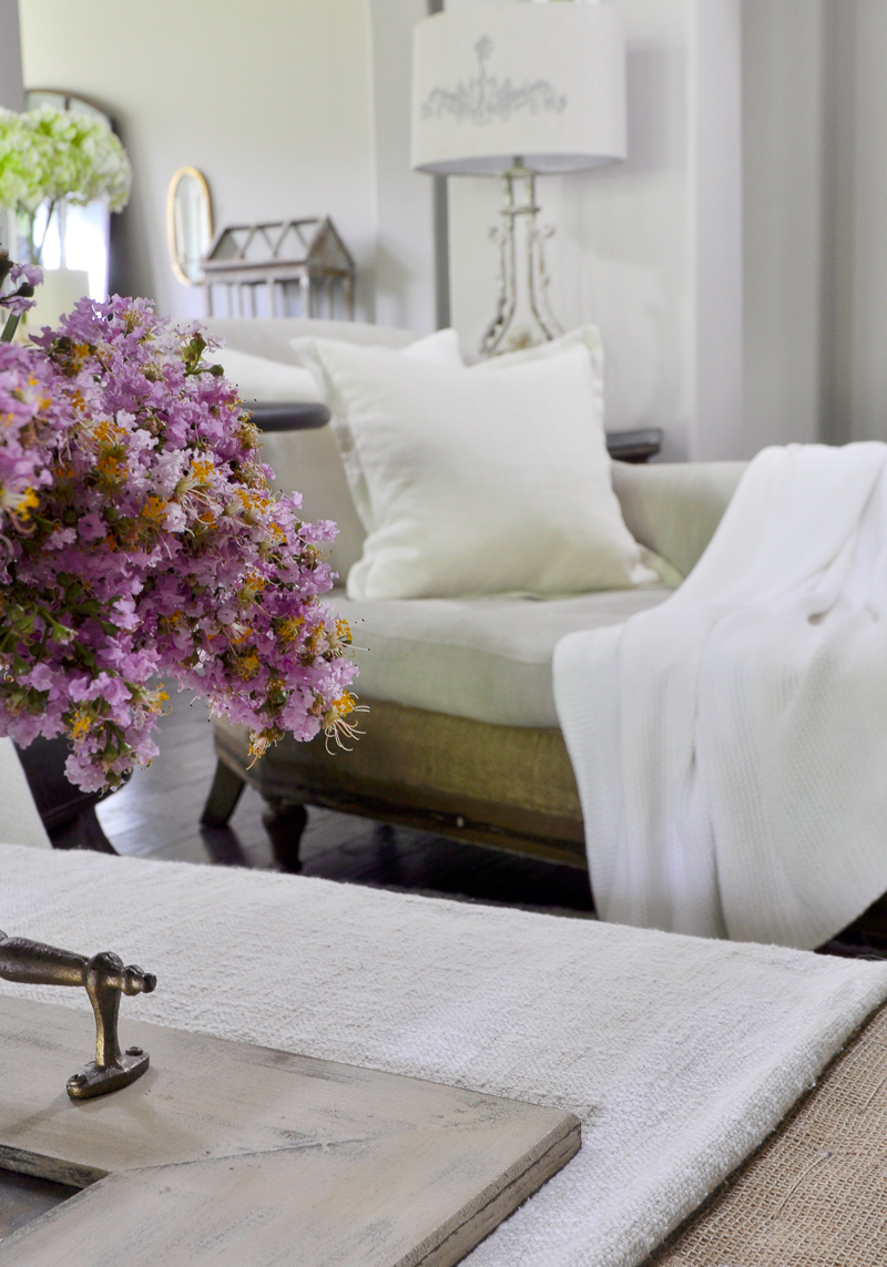 Cozy White Chaise with Linen Pillow and Throw for Summer