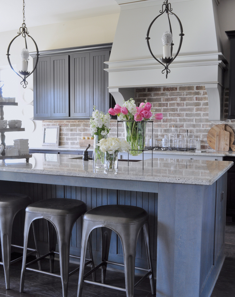 Industrial Kitchen Brick Backsplash and Large Venthood_