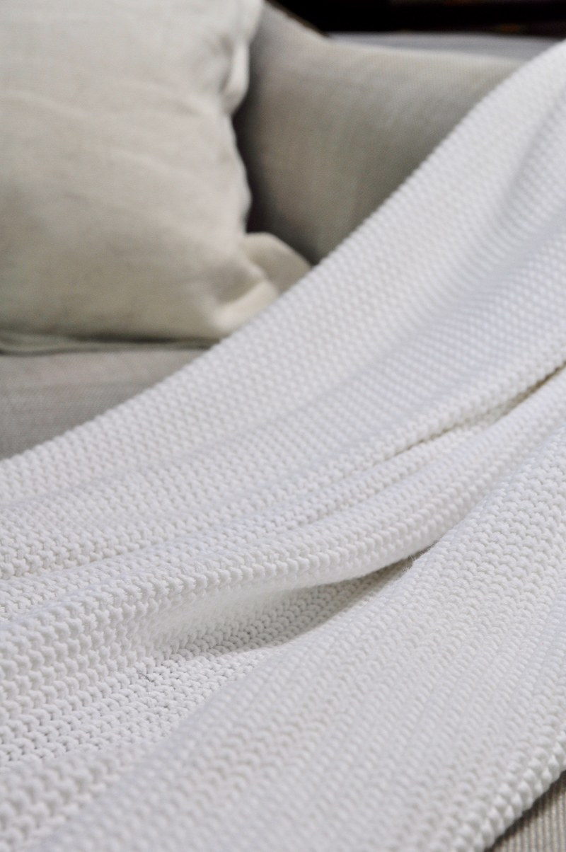 White Summer Throw Blanket on a Linen Chair_