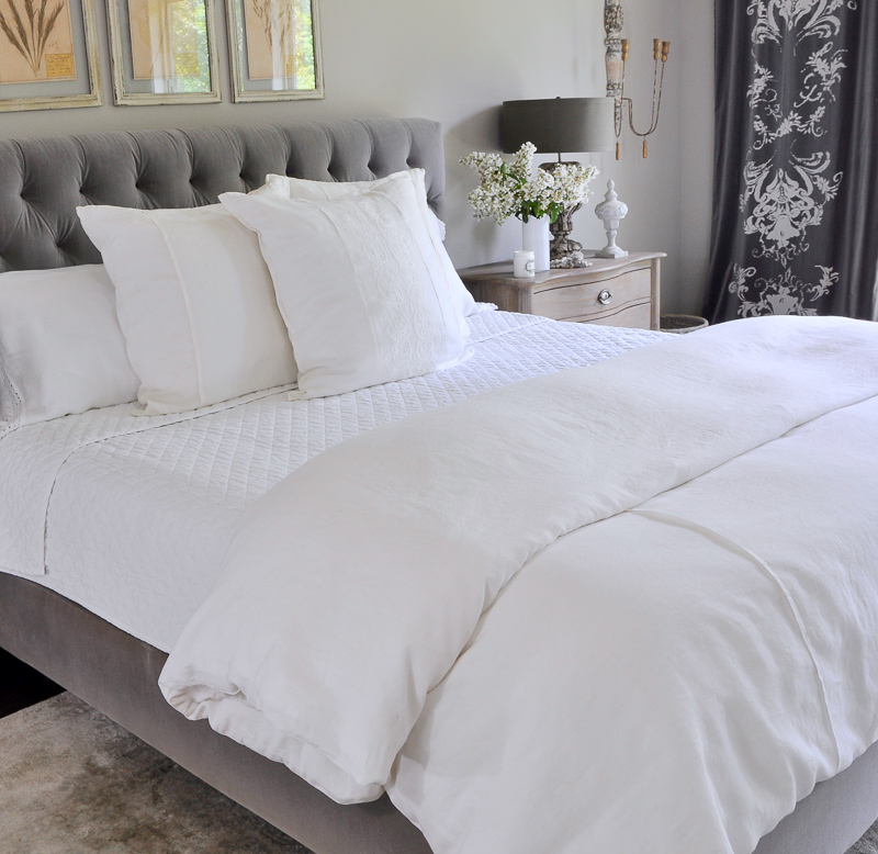 beautiful all white summer bedding in gray and white room