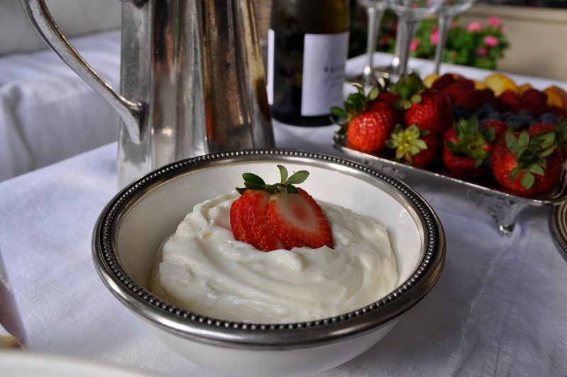 Outdoor patio dinner with flowers white dinnerware and pewter and beautiful salads and fruit-12