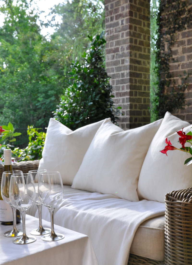 Outdoor patio dinner with flowers white dinnerware and pewter and beautiful salads and fruit-15