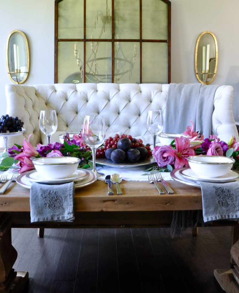 dinner party set with arte italica pieces and beautiful floral garland centerpiece in elegant dining room