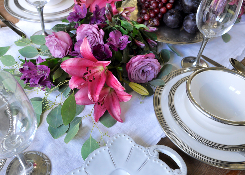 dinner party set with arte italica pieces and beautiful floral garland centerpiece_