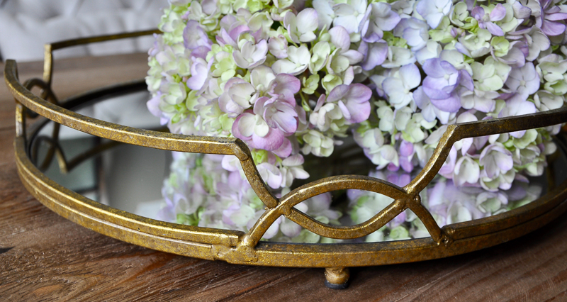 Beautiful gold tray with purple hydrangeas