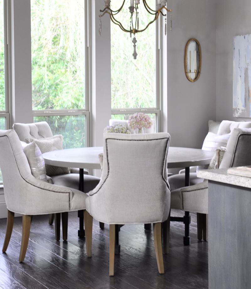 Bright breakfast nook with round six seat table-2