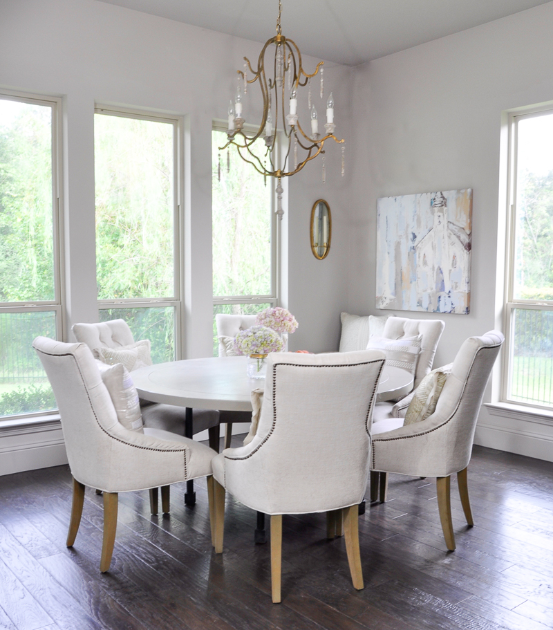 Bright breakfast nook with round six seat table-3