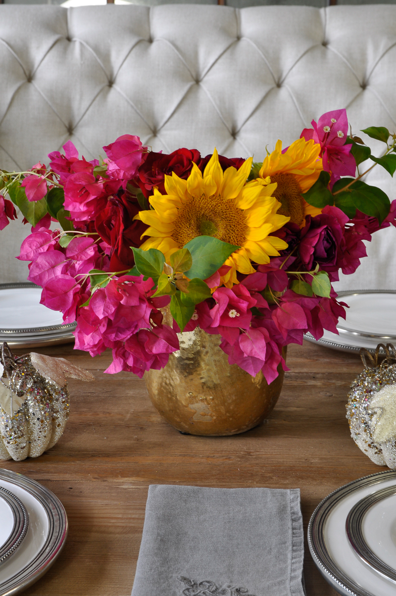 bright-pink-and-yellow-centerpiece-floral-arrangement-gold-vase-and-glitter-pumpkins