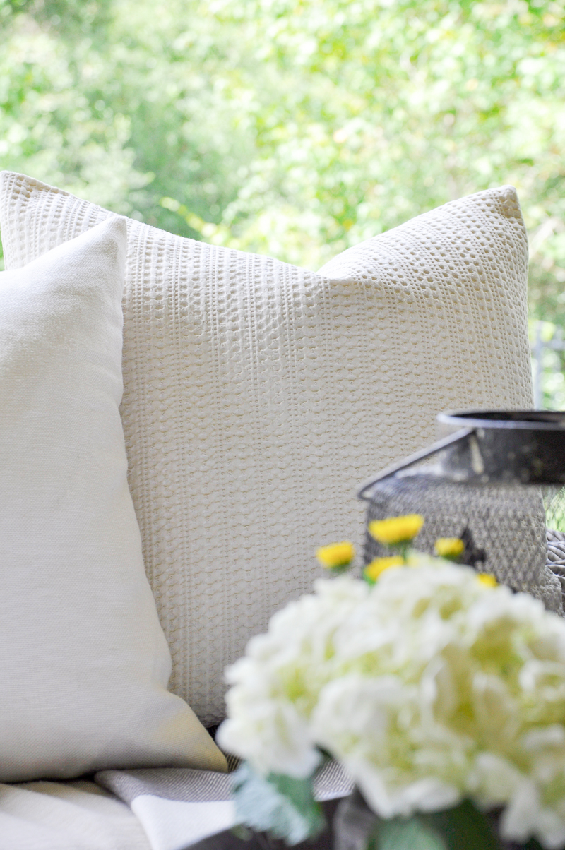 pottery-barn-pillows-on-covered-pation-for-fall-so-pretty