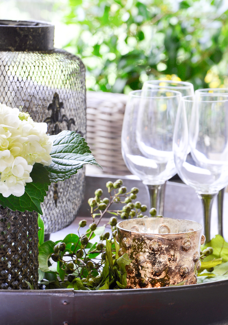 wine-glasses-flowers-and-votive-on-a-decorative-tray_