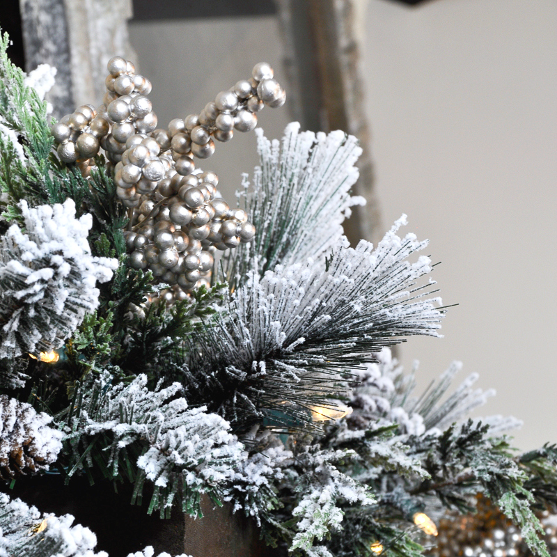 A Rustic Holiday Mantle with Flocked Garland