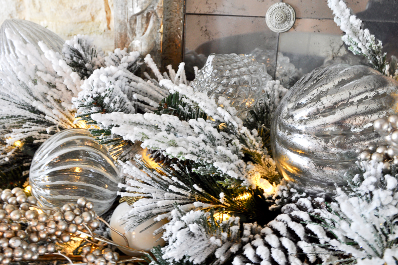 mercury-glass-ornaments-added-to-garland-on-mantle_