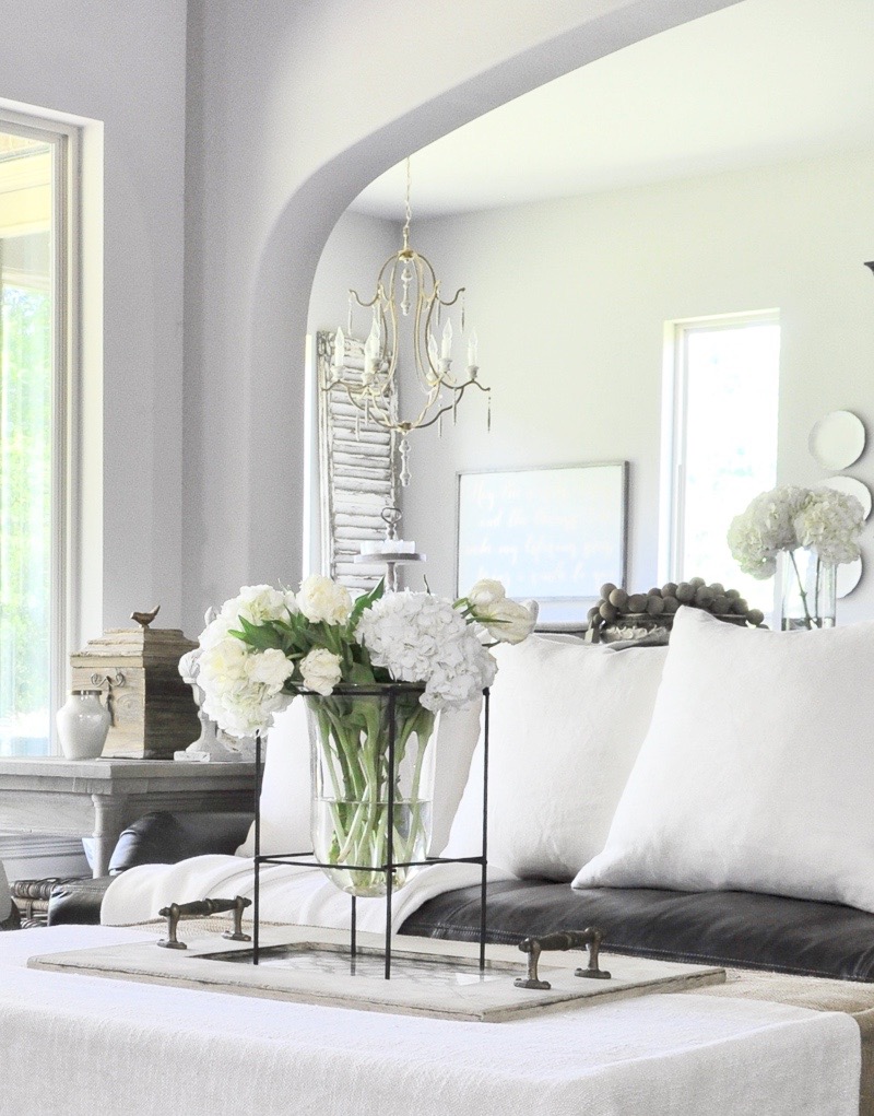 family-room-with-leather-sofa-with-large-white-pillows-by-decor-gold-designs