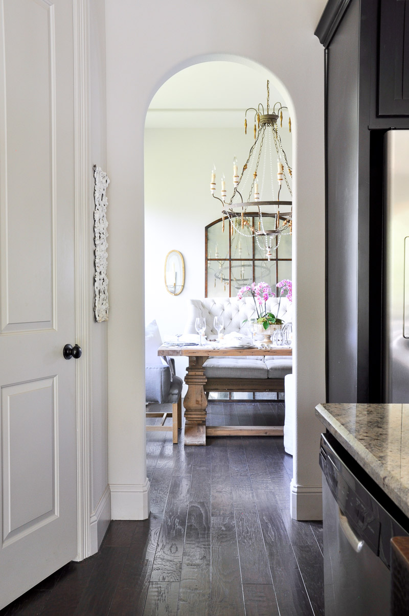 elegant dining room with farm table set for easter