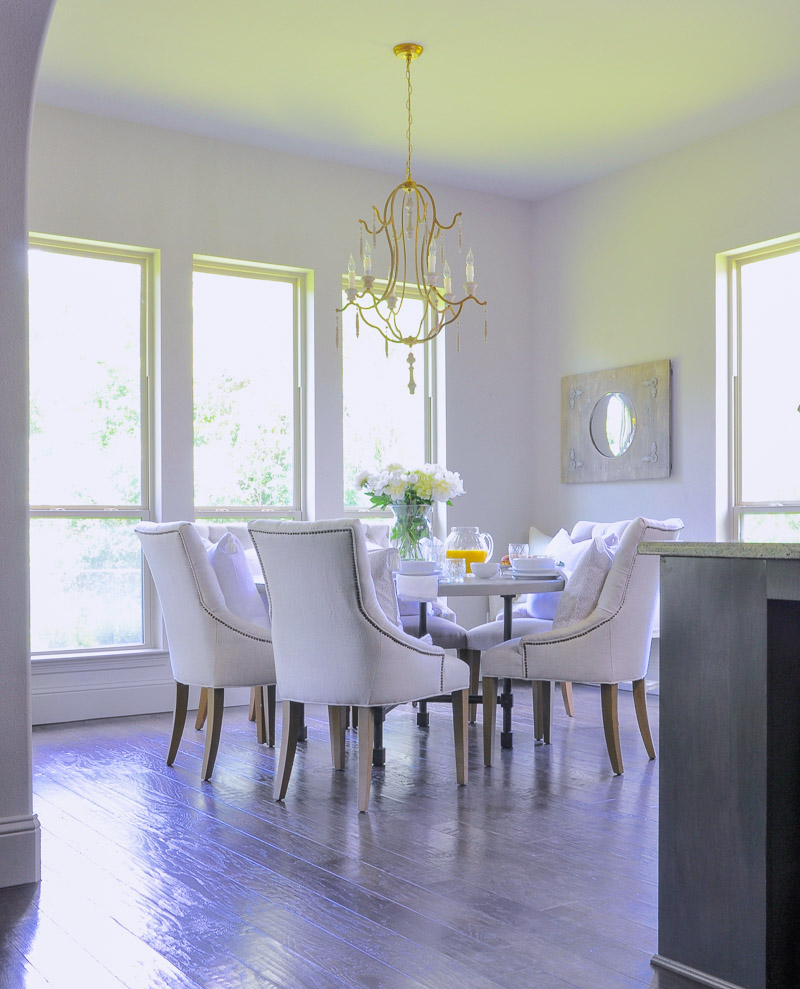 bright white breakfast nook with round table 