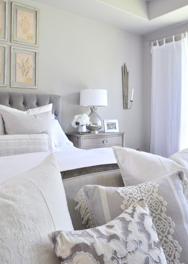 master bedroom with beautiful neutral pillows 