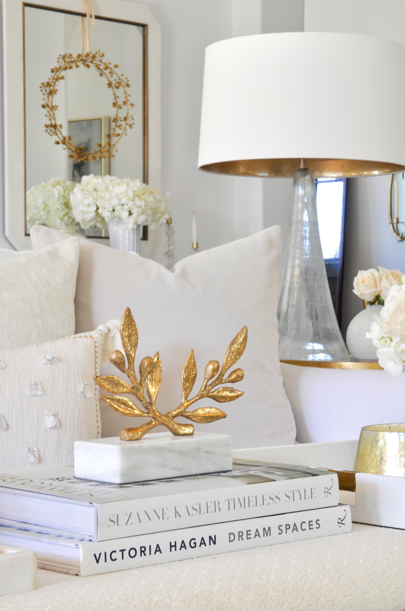 gold accessories in elegant white living room