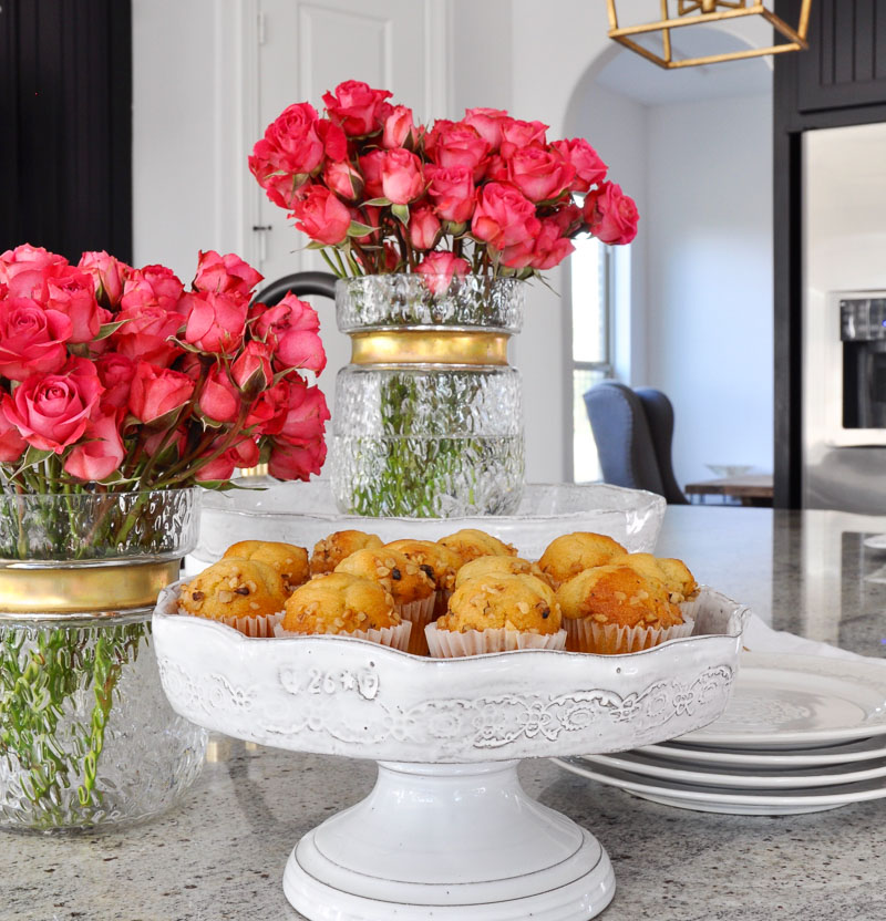 beautiful kitchen counter with muffins and flowers