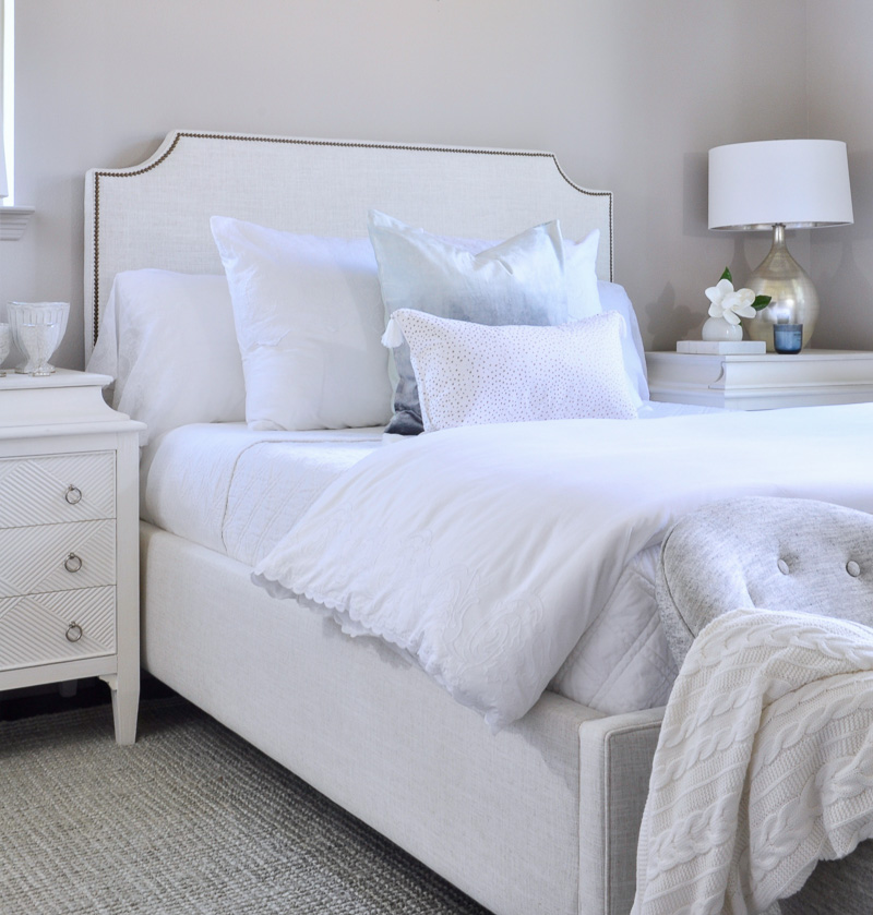 beautiful white bedroom in an inviting home