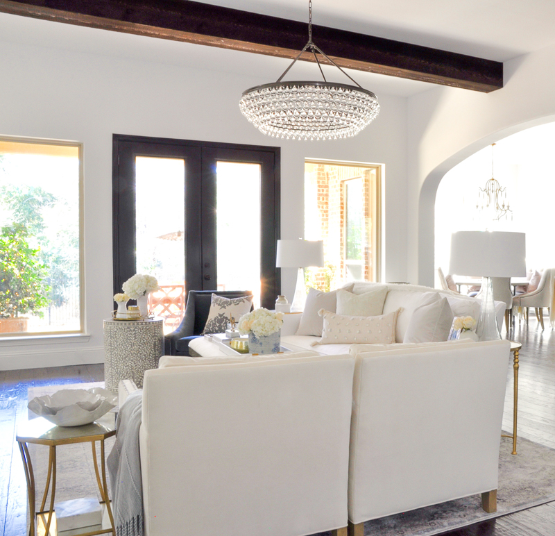 timeless and elegant white living room with beams