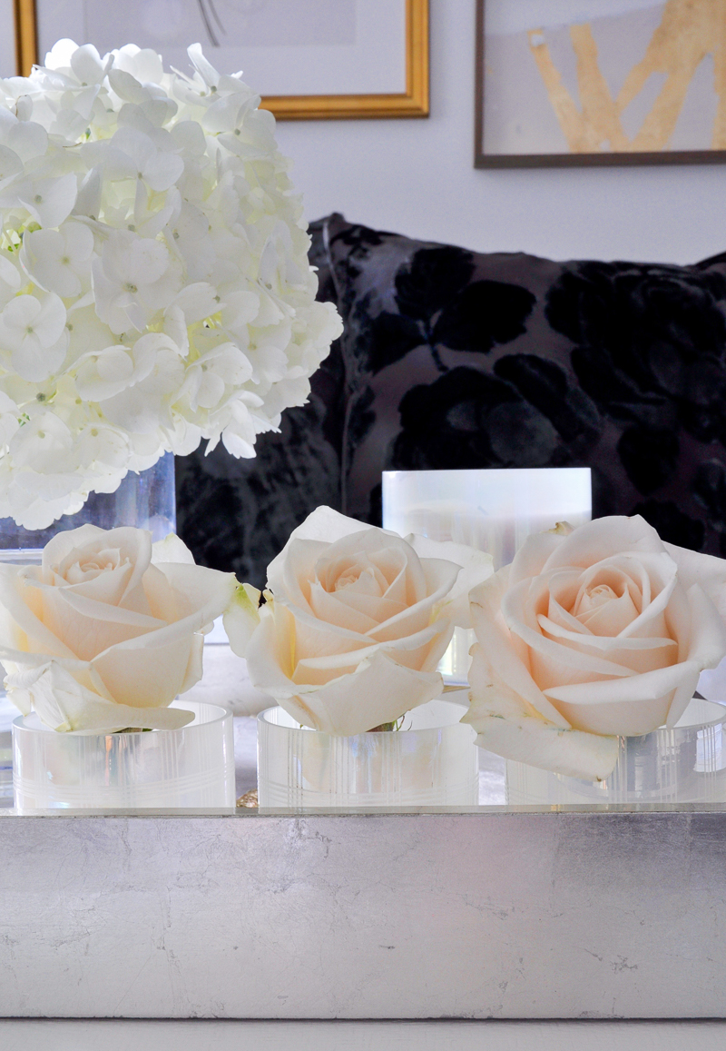 roses arranged in votives