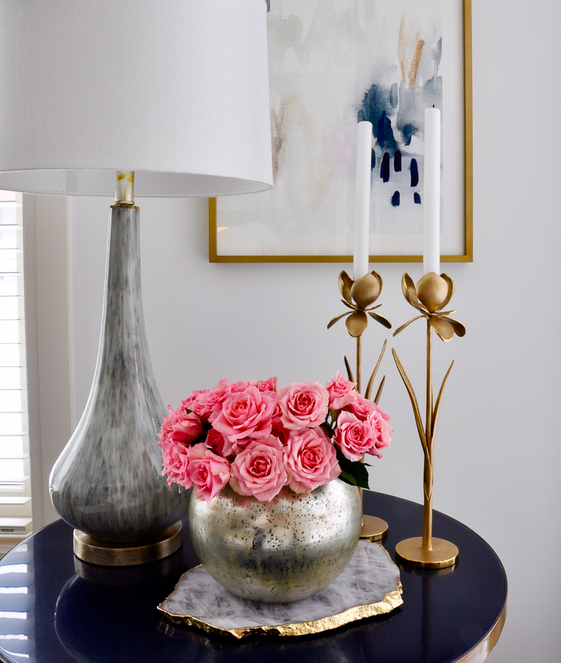 silver round vase full of roses