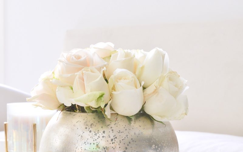 silver round vase full of roses