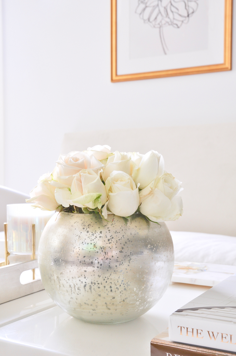 silver round vase full of roses