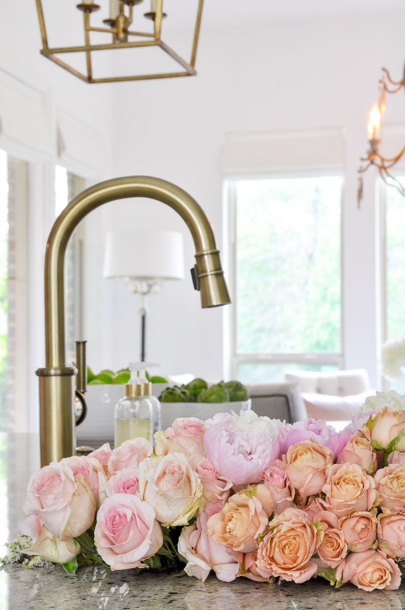 Beautiful spring flowers in kitchen sink