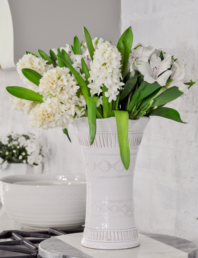 Beautiful spring flowers in white vase