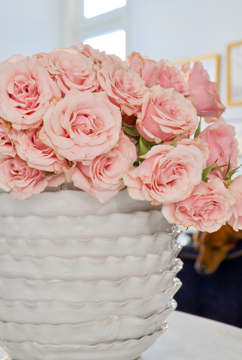 beautiful white vase with pink spray roses