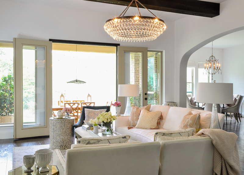 beautiful bright spring living room with elegant chandelier 