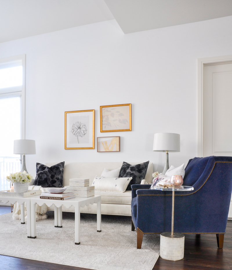 bright white living room with gold and navy accents