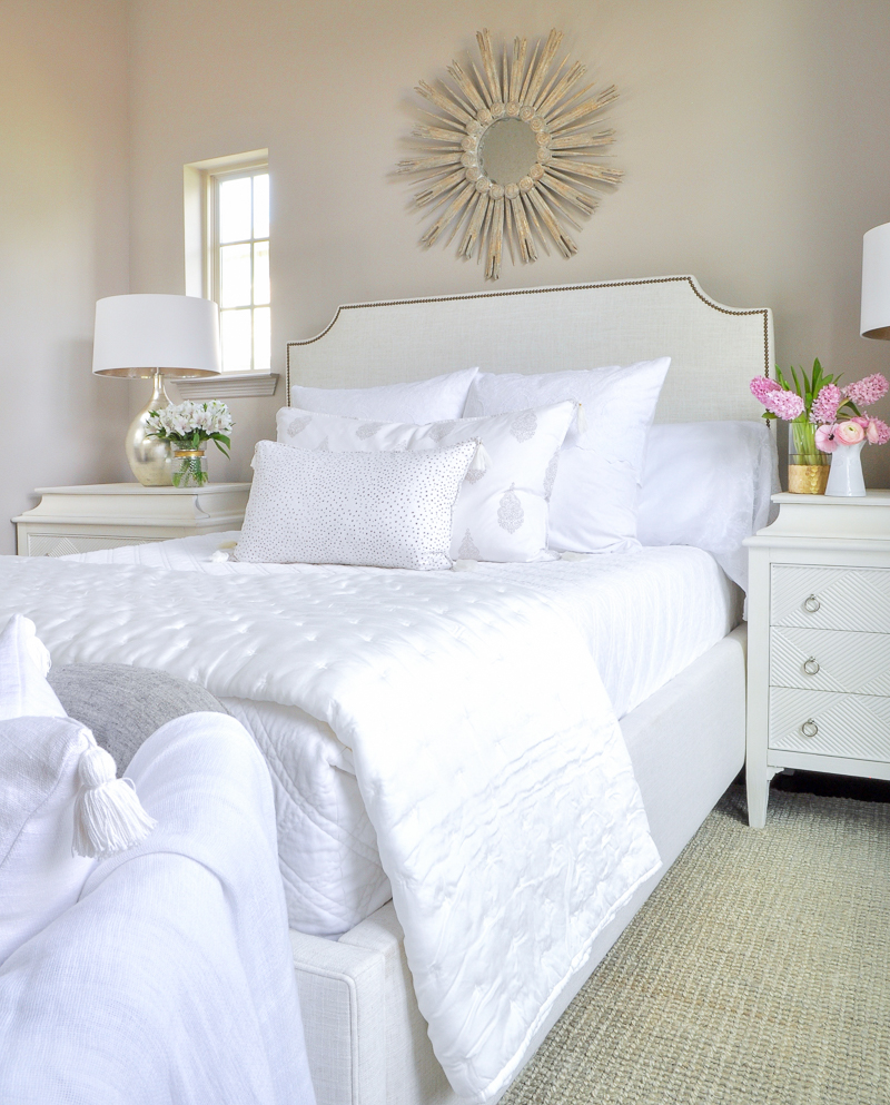 guest bedroom with white bed and bedding