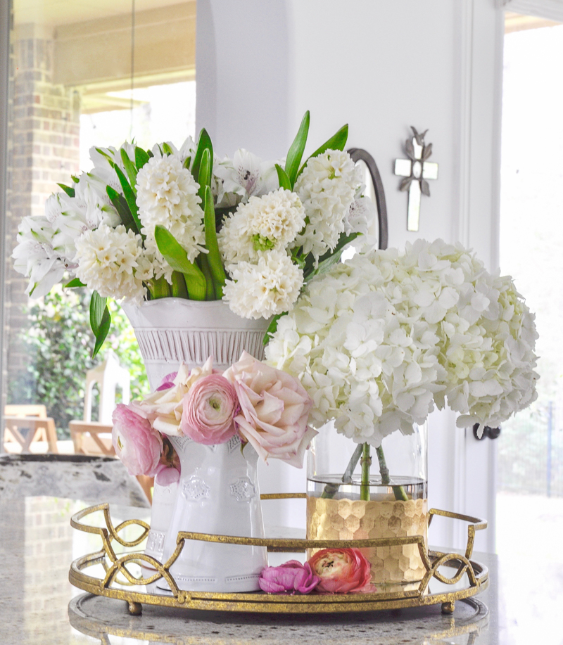 trio of vases with spring flowers